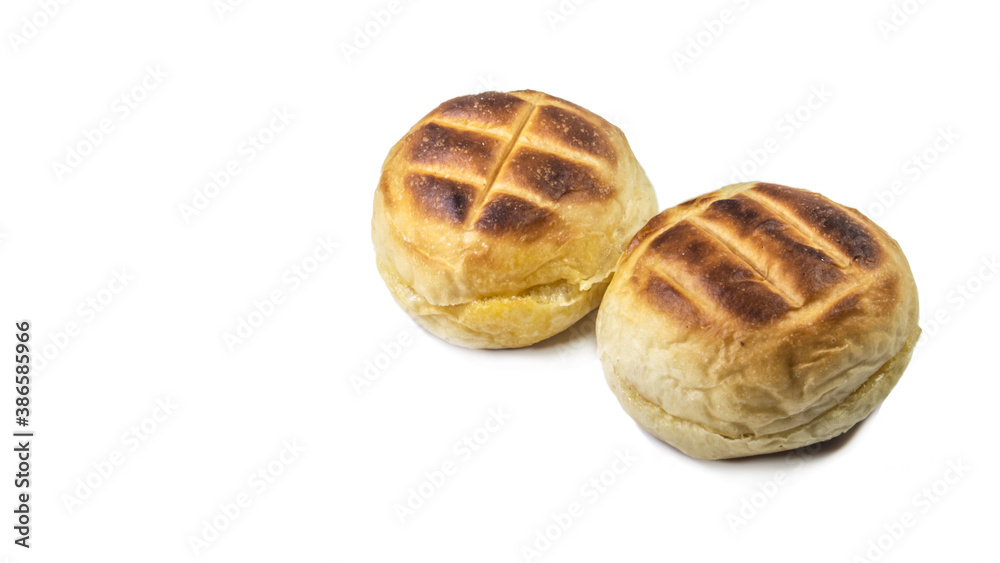 Round bun charcoal grilled serve with crispy bread skin, isolated on the white background. Round bun charcoal grilled serve with crispy bread skin, isolated on the white background.