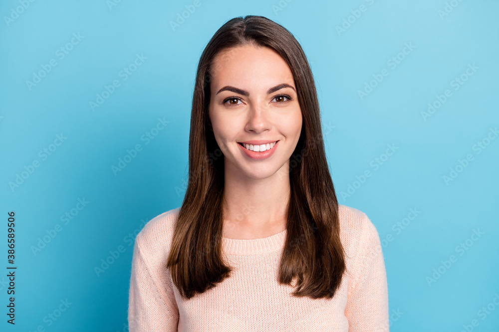 Portrait of lovely nice girl look in camera toothy smiling wear beige pullover isolated over blue color background - obrazy, fototapety, plakaty 