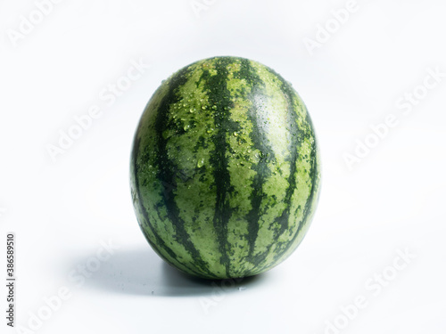 Whole ripe watermelon isolate on the white background.