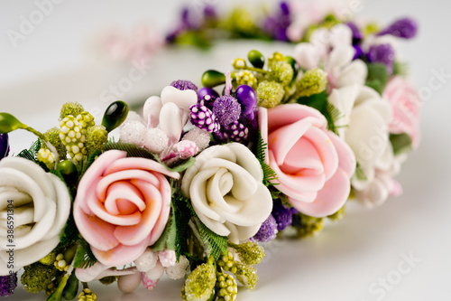 Hair hoop decorated with delicate color artificial flowers.