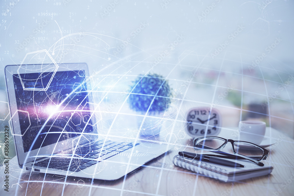 Double exposure of desktop with computer and world map hologram. International data network concept. Double exposure of desktop with computer and world map hologram. International data network concept.