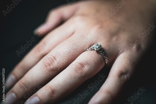 beautiful diamond engagement ring on finger © shane