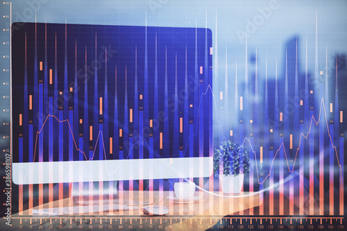 Financial graph colorful drawing and table with computer on background. Double exposure. Concept of international markets. © peshkova