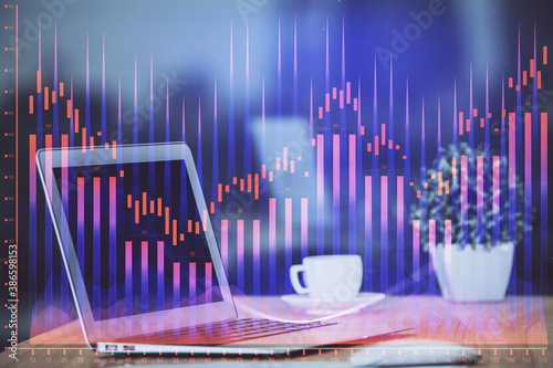 Stock market chart hologram drawn on personal computer background. Multi exposure. Concept of investment.