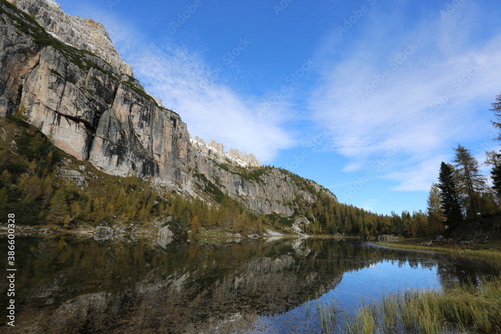 Autumn in the Dolomites, view of Federa lake surrounded by mountains Autumn in the Dolomites, view of Federa lake surrounded by mountains