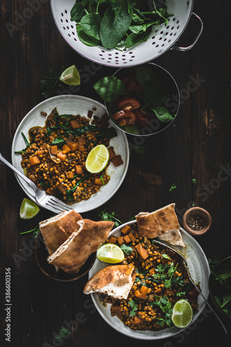 Indian vegetarian vegan food dahl with naan bread top view