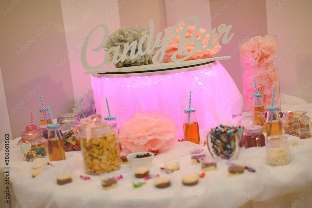 Delicious sweets on candy buffet. Wedding bakes on trays