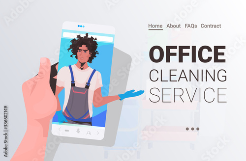 male janitor man cleaner on smartphone screen self isolation office cleaning service concept horizontal copy space portrait vector illustration
