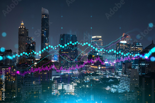 FOREX graph hologram, aerial night panoramic cityscape of Bangkok, the developed location for stock market researchers in Asia. The concept of fundamental analysis. Double exposure.