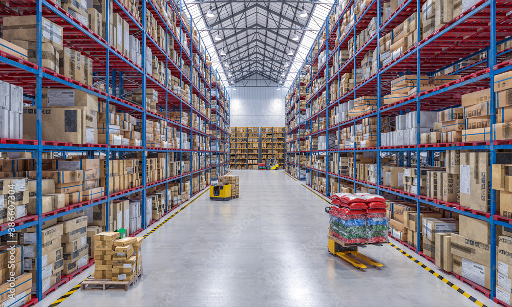 large warehouse full of goods and with lifting equipment.
