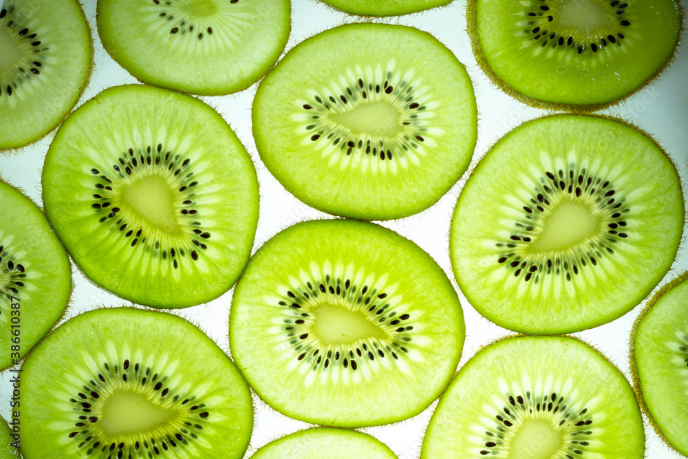 Fresh Kiwi fruit sliced use for background, Transparent Kiwi slices texture pattern for background Fresh Kiwi fruit sliced use for background, Transparent Kiwi slices texture pattern for background