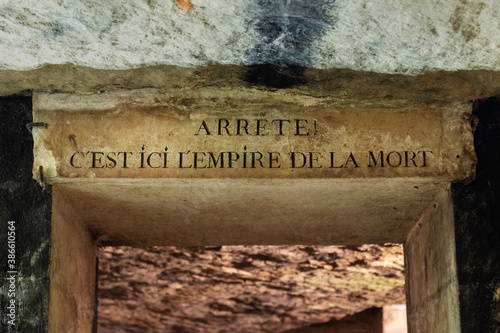 Entrance door of the catacombs of Paris, France. Text in French meaning: 