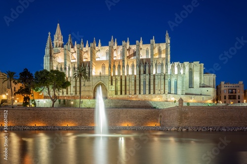 Palma Cathedral and fountain illuminated in the evening, Palma, Mallorca, Spain
