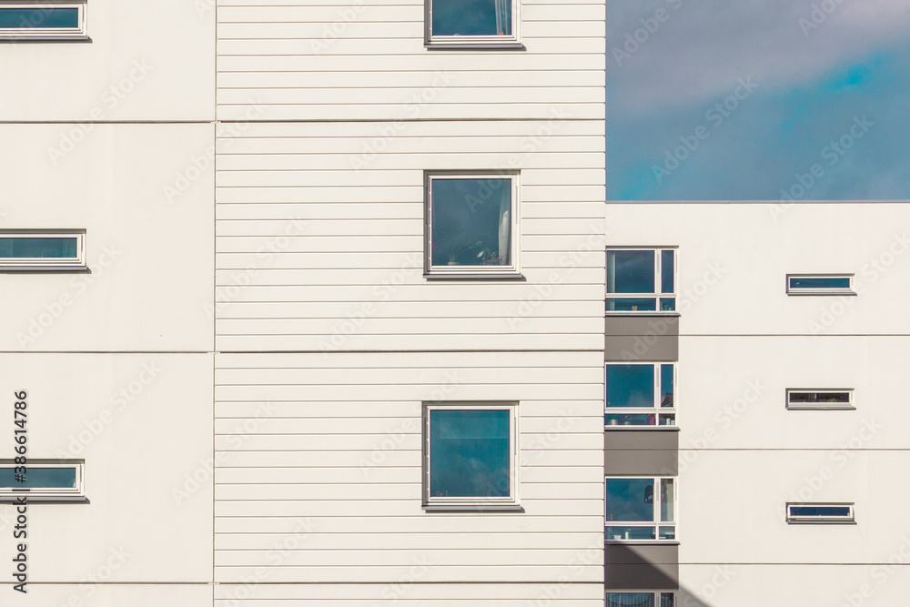 Modern Residential Building in Oslo, Norway.
Façade Detail with Square and Rectangular Window Frames. Architectural Photography. Minimal Aesthetics.  Repetition, Pattern and Rhythm in Architecture.