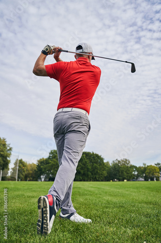 Skilled golfer perfecting the golf swing outside