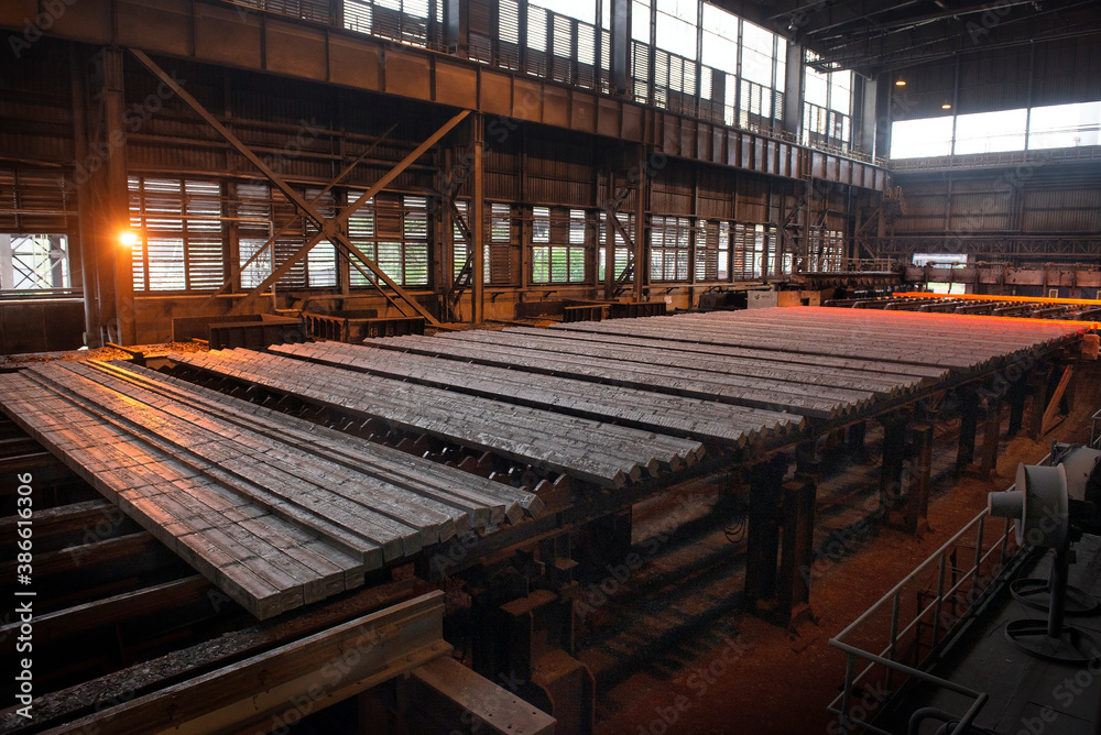 Steel production in electric furnaces. Sparks of molten steel. Electric arc furnace shop . Metallurgical production, heavy industry, engineering, steelmaking