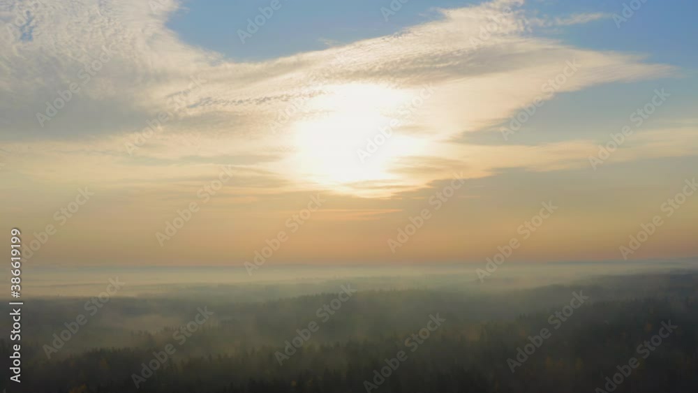 Drone shot of vast misty wilderness by dawn. Sliding steady. Drone shot of vast misty wilderness by dawn. Sliding steady.
