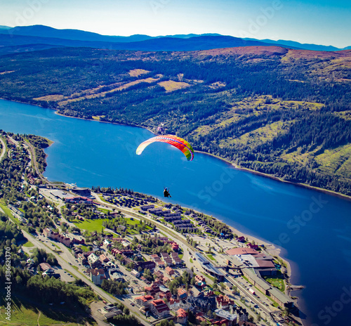 Paraglider river lake air view village