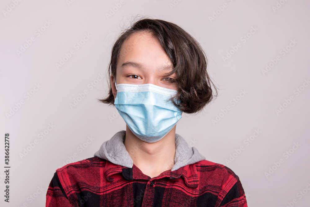 Young boy wearing mask to stay safe and prevent spreading of corona virus Young boy wearing mask to stay safe and prevent spreading of corona virus