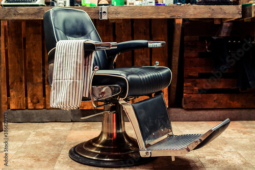 Vintage barber chair. Barbershop business. Barber shop for men. Barbershop theme. Barbershop interior.