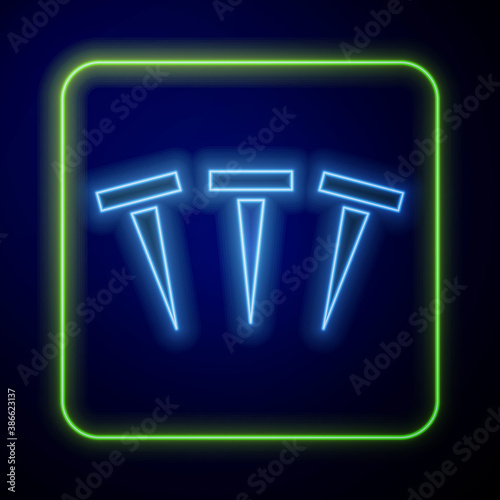 Glowing neon Metallic nails icon isolated on blue background. Vector.