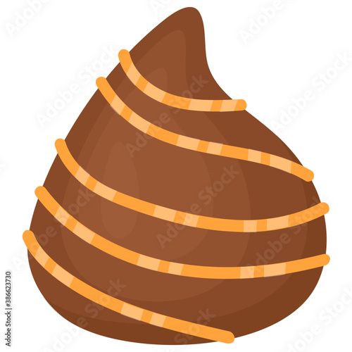 
Chocolate shaped in teardrop with swirls of butterscotch on the top 
