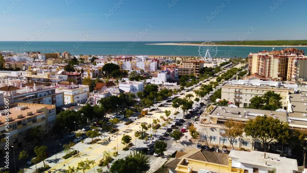 Aerial view of Sanlucar cityscape and ocean on sunny day, Cadiz, Spain Aerial view of Sanlucar cityscape and ocean on sunny day, Cadiz, Spain