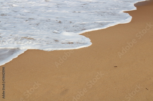 waves on the sand in a desert beach