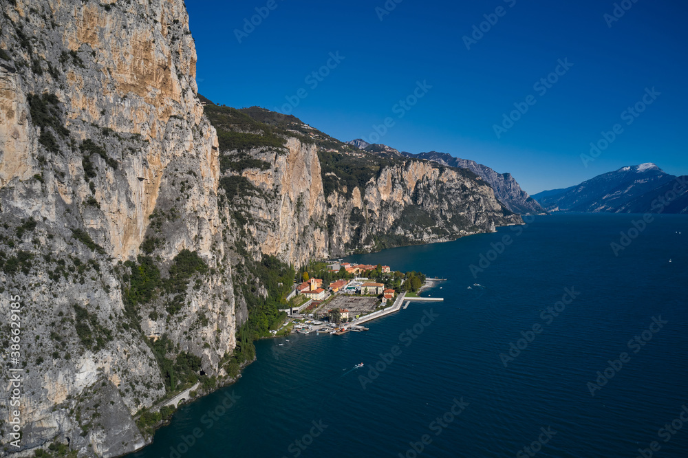 Italian resort on Lake Garda. Aerial view at high altitude of the town by the cliff. Town Campione Lake Garda Italy. Panoramic view of the old town of Campione.