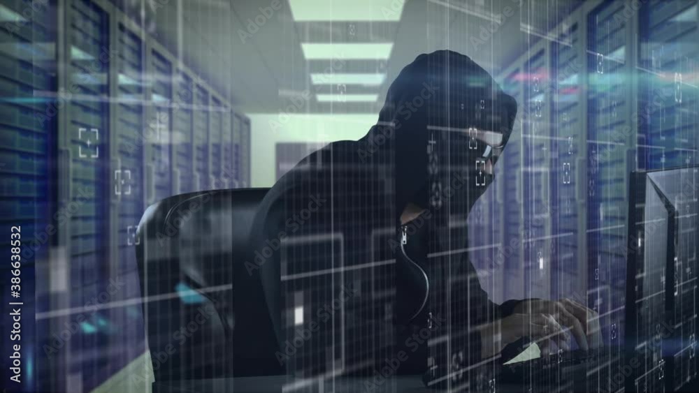 Data processing against male hacker using laptop in server room Data processing against male hacker using laptop in server room