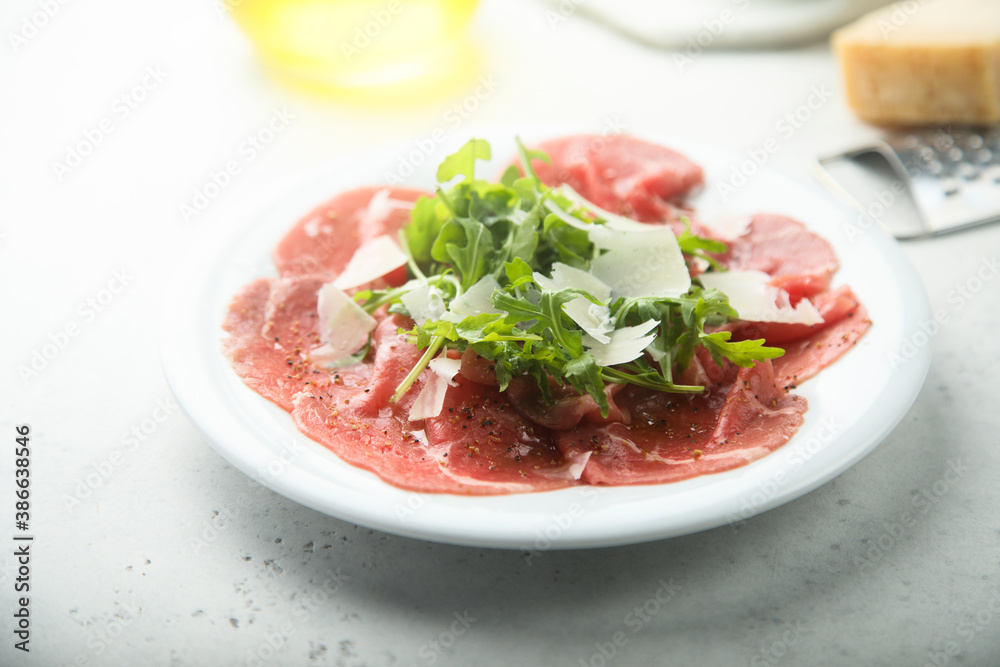 Traditional beef carpaccio with arugula Traditional beef carpaccio with arugula