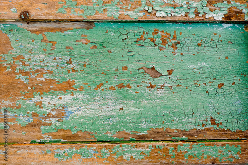 Old green board with cracks.