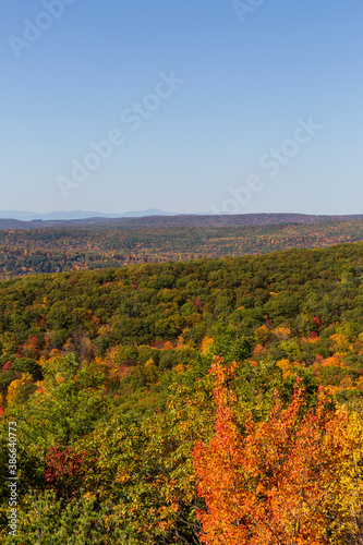 Colorful Autumn vistas of mountains and valleys. Yellow, orange and red leaves glisten in the sunshine- 4