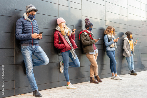 Konstfotografi group of multi-ethnic friends watching the news of the coronavirus, millennials