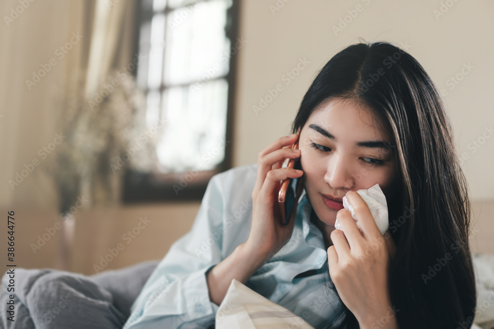 Young adult lonely single woman using smartphone in the moring for talking app with friend for mental health. Young adult lonely single woman using smartphone in the moring for talking app with friend for mental health.