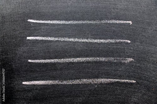 White color chalk hand drawing in set of line shape on black board background