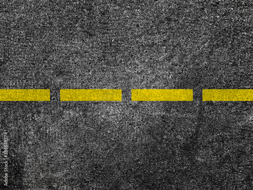 Foto Yellow line on asphalt road background