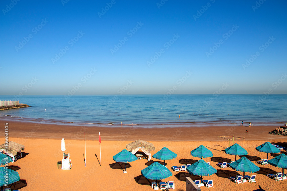 View of a beach from above on sunny morning. View of a beach from above on sunny morning.