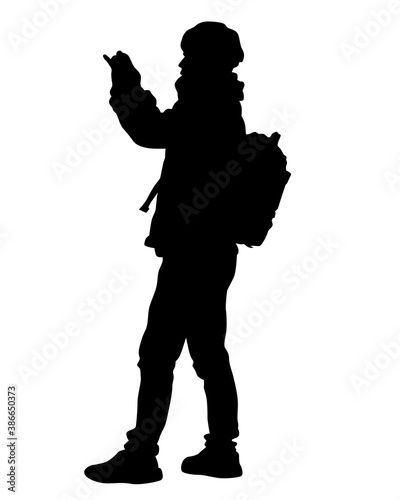 Tourists with smartphones in their hands take pictures of themselves. Isolated silhouettes on white background