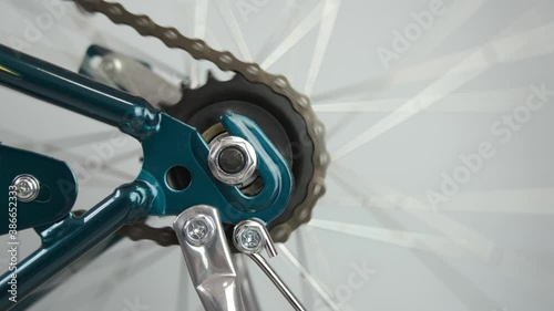 Testing the rotation of the Bicycle wheel and chain after repair. the concept of repair, traveling by Bicycle