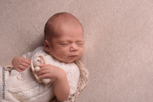 portrait of a little infant newborn baby: baby's face close-up. concept of childhood, healthcare, IVF
