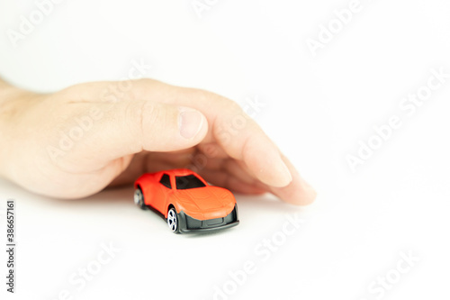 hands over a toy car