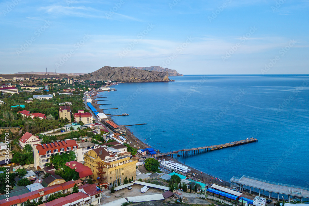 Panorama of resort town Sudak (Crimea) & Black Sea from top of medieval Genoese fortress