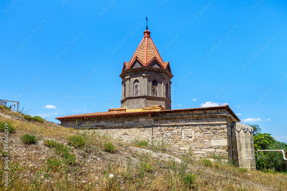 Armenian apostolic church of St George, Feodosia, Crimea. It was built in XIV. Ground level is higher on one side of building, so the church seems to be 'growing out' of ground