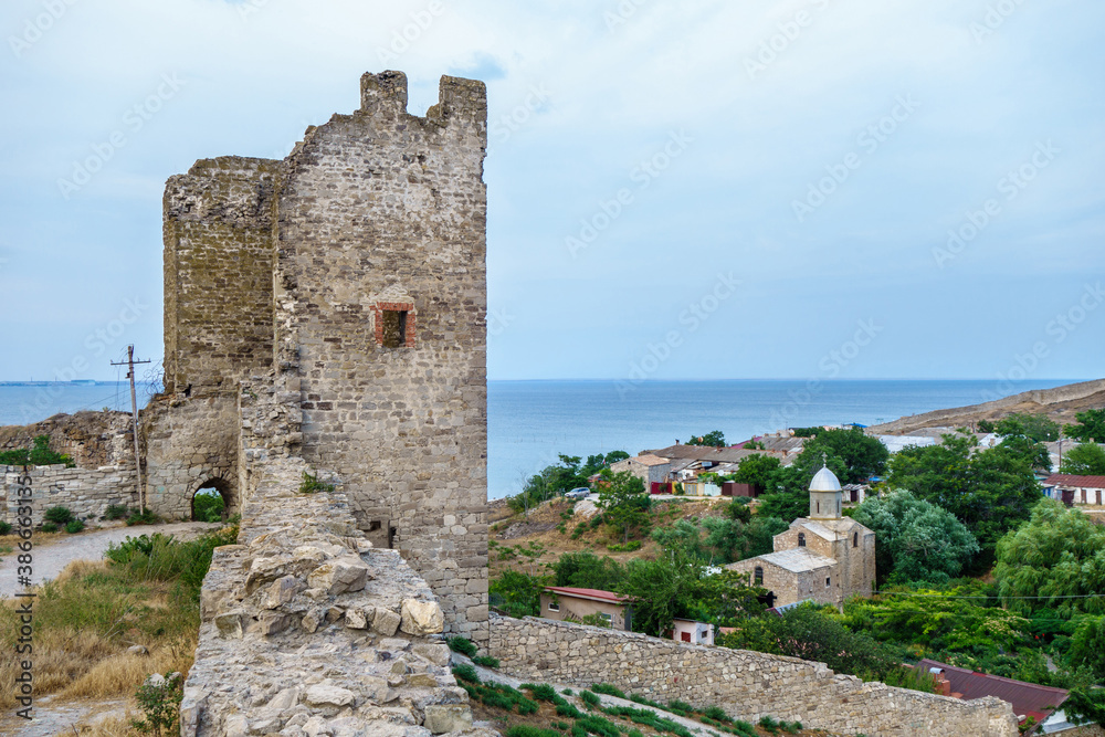 Panorama from medieval walls of Genoese fortress, Feodosia, Crimea. There are one of its towers, church of St. John The Baptist & Black Sea (on distant background)