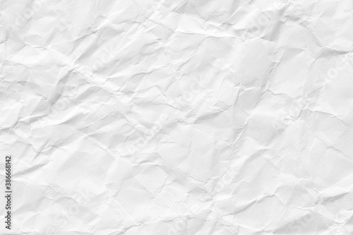 White crumpled paper background, texture old for web design screensavers. Template for various purposes or creating packaging.