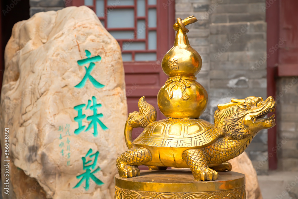 Religious statue at Tianhou Palace - a famous Taoist temple in Tianjin, China