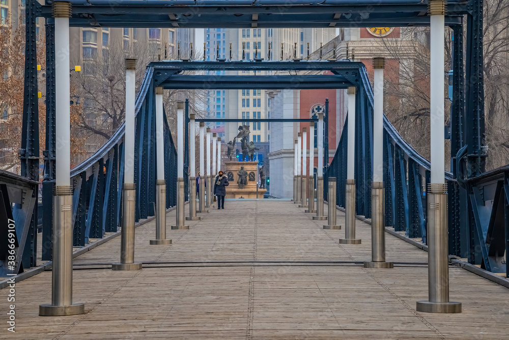 Fototapeta premium Tianjin pedestrian wooden bridge over Haihe river in Nankai district in Tianjin, China