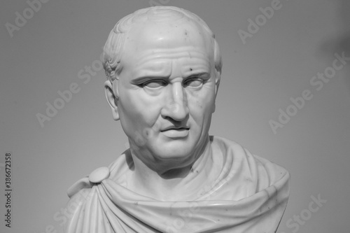 Cicero, the greatest ancient roman orator, marble statue in front of Rome Old Palace of Justice, made in 19th century (isolated on white background) photo
