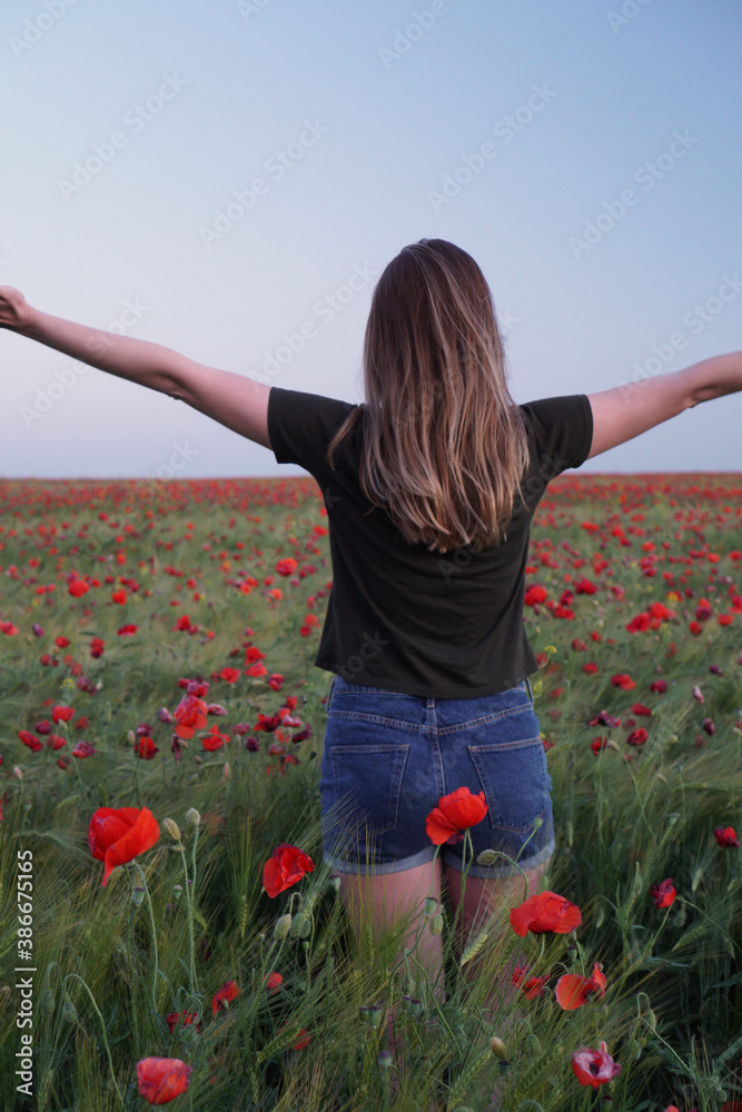 happy girl in the poppy field freedom